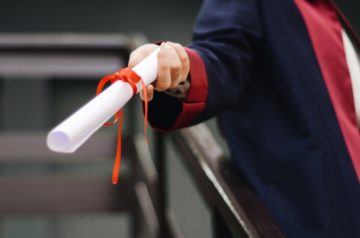 Person holding a diploma