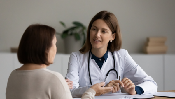 Provider and Patient converse across a table