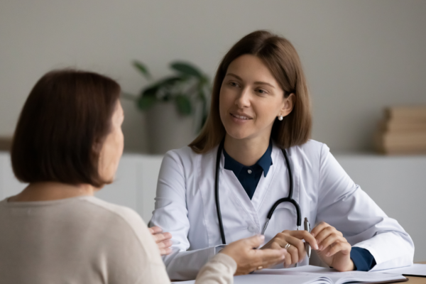 Provider and Patient converse across a table