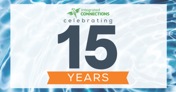 Text "Celebrating 15 years of Integrated Connections" overlaying water creating a ripple.