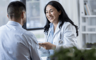 Female physician speaking to a patient with a smile.